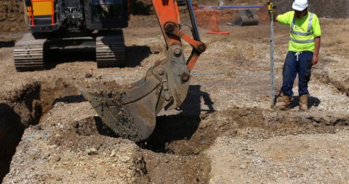 mackoy-plant-machinery-excavator-digging-foundations-with-groundworks-operative-supervising